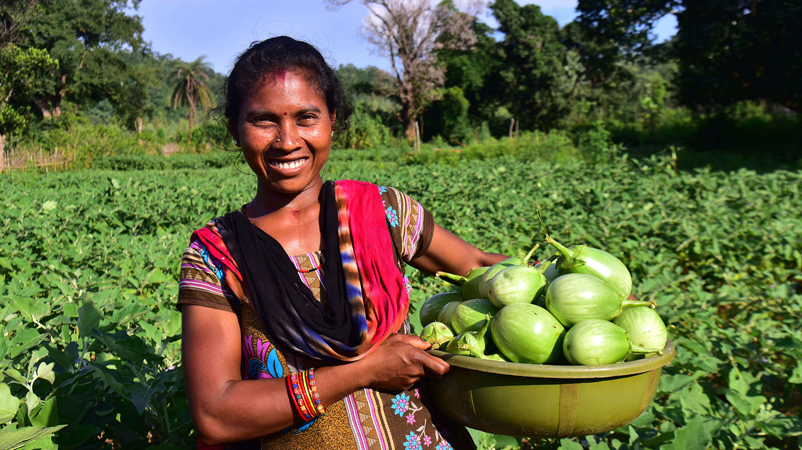 Muni Heprika with her agricultural produce; brinjals